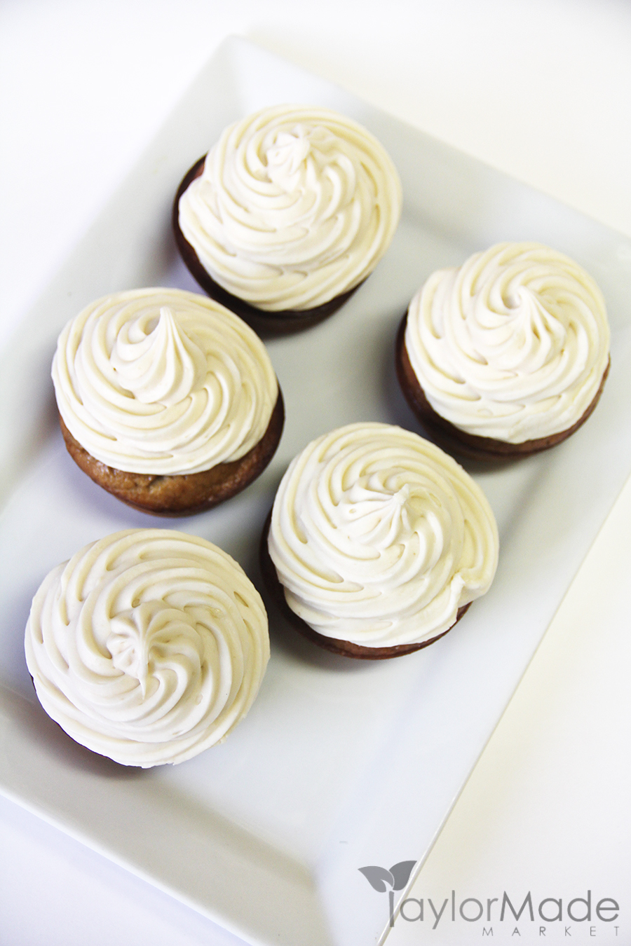 cupcakes with frosting on white vertical