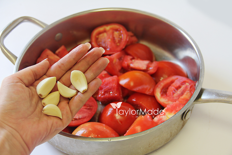 tomatoes in a saucepan with garlic